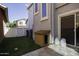 Enclosed backyard with dog house, artificial turf and a paved patio at 3065 E Tamarisk St, Gilbert, AZ 85296