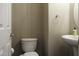 Half-bathroom features a pedestal sink and neutral finishes at 3065 E Tamarisk St, Gilbert, AZ 85296