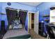 This bedroom has an unusual bed with a curtain and an adjacent bathroom at 3065 E Tamarisk St, Gilbert, AZ 85296