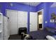 This cozy bedroom features blue walls, carpeted floors, and a closet with sliding doors at 3065 E Tamarisk St, Gilbert, AZ 85296
