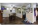 Open-concept home boasts hardwood floors, and a dining area with ceiling fan at 3065 E Tamarisk St, Gilbert, AZ 85296