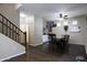 Open-concept home boasts hardwood floors, stairs, and a dining area with a unique dragon head at 3065 E Tamarisk St, Gilbert, AZ 85296
