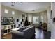 Bright living room featuring hardwood floors, comfortable seating, and plenty of natural light at 3065 E Tamarisk St, Gilbert, AZ 85296