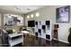 Spacious living room with stylish shelving and hardwood floors, perfect for entertaining at 3065 E Tamarisk St, Gilbert, AZ 85296