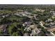 This aerial showcases a community with a school, green spaces, and the neighborhood's pool at 3065 E Tamarisk St, Gilbert, AZ 85296