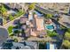 Aerial view of a luxurious home showcasing a pool, tennis court, lush landscaping, and a spacious backyard at 3118 W Glenhaven Dr, Phoenix, AZ 85045