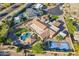 Aerial view highlighting a luxury home with pool, sports court, and manicured landscaping, perfect for outdoor living at 3118 W Glenhaven Dr, Phoenix, AZ 85045