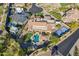 Drone shot featuring a private backyard oasis, with a sparkling pool, sports court, and plush landscaping at 3118 W Glenhaven Dr, Phoenix, AZ 85045