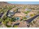 Wide aerial view showcasing an elegant desert neighborhood with luxury homes, mature trees, and scenic streets at 3118 W Glenhaven Dr, Phoenix, AZ 85045