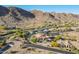 Scenic aerial view captures a luxurious desert neighborhood with beautiful homes and meticulously landscaped yards at 3118 W Glenhaven Dr, Phoenix, AZ 85045