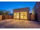 Beautiful backyard with large greenhouse and wood gates on a brick driveway at 3118 W Glenhaven Dr, Phoenix, AZ 85045