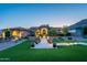 Inviting desert property boasting lush landscaping, a charming stone facade, and a serene setting at 3118 W Glenhaven Dr, Phoenix, AZ 85045