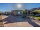 Stunning single-story home boasts a grand arched entryway, manicured landscaping, and a spacious brick driveway at 3118 W Glenhaven Dr, Phoenix, AZ 85045