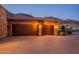 Large multi-car garage with desert landscape. Private lot with mountain backdrop at 3118 W Glenhaven Dr, Phoenix, AZ 85045