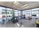 Bright greenhouse with shelves and fixtures for nurturing a thriving garden at 3118 W Glenhaven Dr, Phoenix, AZ 85045
