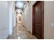 Elegant hallway with arched ceilings, decorative lighting, and beautiful tile flooring at 3118 W Glenhaven Dr, Phoenix, AZ 85045