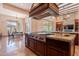 Kitchen with a chef's island, professional range, and seamless connection to the living area at 3118 W Glenhaven Dr, Phoenix, AZ 85045
