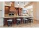 Well-equipped kitchen with a large island, granite countertops, and ample cabinet space at 3118 W Glenhaven Dr, Phoenix, AZ 85045