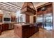 Gourmet kitchen with a large center island, custom cabinets, and professional-grade appliances at 3118 W Glenhaven Dr, Phoenix, AZ 85045