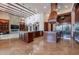 Spacious kitchen with two islands, beam ceilings, stone accents, and lots of natural light at 3118 W Glenhaven Dr, Phoenix, AZ 85045