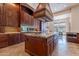 Spacious kitchen with center island, granite countertops, and stainless steel appliances at 3118 W Glenhaven Dr, Phoenix, AZ 85045