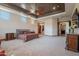 Spacious primary bedroom boasts tray ceilings, recessed lighting, ceiling fan, and ensuite bathroom access at 3118 W Glenhaven Dr, Phoenix, AZ 85045