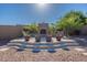 Outdoor fireplace and lounge area featuring an outdoor space that's perfect for entertaining at 3118 W Glenhaven Dr, Phoenix, AZ 85045