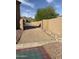 Gravel-covered side yard featuring desert landscaping and stone pavers, and a block wall for privacy at 3118 W Glenhaven Dr, Phoenix, AZ 85045