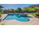 Beautiful pool features a built-in spa, stepping stones, with mountain views and blue lounge chairs at 3118 W Glenhaven Dr, Phoenix, AZ 85045