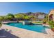 Sparkling swimming pool and hot tub surrounded by a lush landscaped backyard with mountain views at 3118 W Glenhaven Dr, Phoenix, AZ 85045