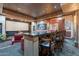 Home theater with bar, plush seating, and large screen at 3118 W Glenhaven Dr, Phoenix, AZ 85045