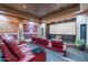 Home theater room with red plush seating and a large screen at 3118 W Glenhaven Dr, Phoenix, AZ 85045