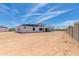 The rear exterior of this white home shows the large lot and bright sky at 3335 W Desert Dawn Dr, Phoenix, AZ 85083