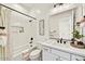 Bright and airy bathroom with modern fixtures, a bathtub with shower, and stylish decor at 3335 W Desert Dawn Dr, Phoenix, AZ 85083