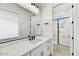 Modern bathroom with quartz countertops, tiled floors, and a glass-enclosed shower at 3335 W Desert Dawn Dr, Phoenix, AZ 85083