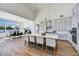 Open kitchen and dining area with a large island, modern appliances, and abundant natural light at 3335 W Desert Dawn Dr, Phoenix, AZ 85083