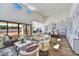 Open-concept living and kitchen area with soaring ceilings and wood flooring at 3335 W Desert Dawn Dr, Phoenix, AZ 85083