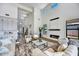 Spacious living area with high ceilings, modern fireplace, and large windows providing ample natural light at 3335 W Desert Dawn Dr, Phoenix, AZ 85083