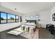 Serene main bedroom features a large window and minimalist decor, creating a peaceful retreat at 3335 W Desert Dawn Dr, Phoenix, AZ 85083