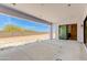 Open patio space with concrete floor, leading to backyard with clear blue sky at 3335 W Desert Dawn Dr, Phoenix, AZ 85083