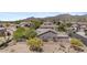 Aerial view of a home with desert landscaping and a tile roof, situated in a neighborhood with mountain views at 3544 N Paseo Del Sol --, Mesa, AZ 85207