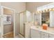 Well lit bathroom with large vanity, framed mirror, and a separate shower at 3544 N Paseo Del Sol --, Mesa, AZ 85207