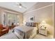 Inviting bedroom with a plush bed, matching nightstands, ample natural light, and shutter-style blinds at 3544 N Paseo Del Sol --, Mesa, AZ 85207