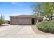 Charming home exterior featuring a well-maintained front yard and attached three-car garage at 3544 N Paseo Del Sol --, Mesa, AZ 85207