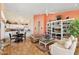 Cozy living room with a white kitchen, dining table, tan sofa, and a decorative bookshelf against colorful walls at 3544 N Paseo Del Sol --, Mesa, AZ 85207