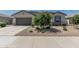 Charming single-story home with a low-maintenance front yard and a two-car garage at 37645 W Santa Clara Ave, Maricopa, AZ 85138