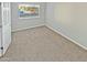 Comfortable bedroom with carpet, a window for natural light, and neutral paint at 3810 N Maryvale Pkwy # 1070, Phoenix, AZ 85031