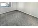 Comfortable bedroom with carpet, a window for natural light, and neutral paint at 3810 N Maryvale Pkwy # 1070, Phoenix, AZ 85031