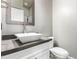 Powder room featuring a modern vessel sink, gray countertop, faucet, and vanity at 42424 N Gavilan Peak Pkwy # 24206, Anthem, AZ 85086
