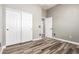 Bedroom features wood-look floors, closet with sliding doors and neutral paint at 42424 N Gavilan Peak Pkwy # 24206, Anthem, AZ 85086